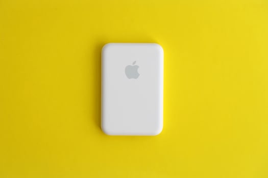 KYIV, UKRAINE - OCTOBER 31, 2023 Apple MagSafe battery device for iPhone charging via magnet connection. Mag Safe modern portable power bank photo