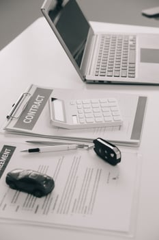 Closeup asian male people car salesman or sales manager offers to sell a car and explains and reads the terms of signing a car contract and insurance. photo