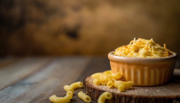 Copy Space image of warm and delicious homemade baked schotel macaroni on a wooden photo