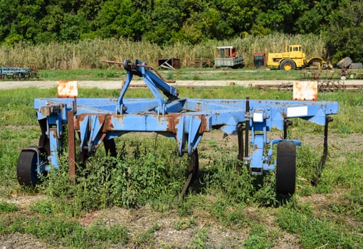 Plow on trailer for tractor. Plow for plowing soil. photo