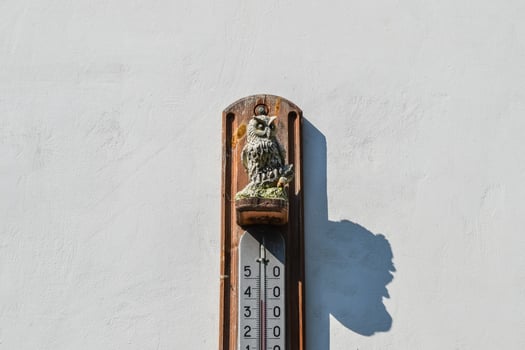 Wall thermometer. A device for measuring the ambient air tempera photo