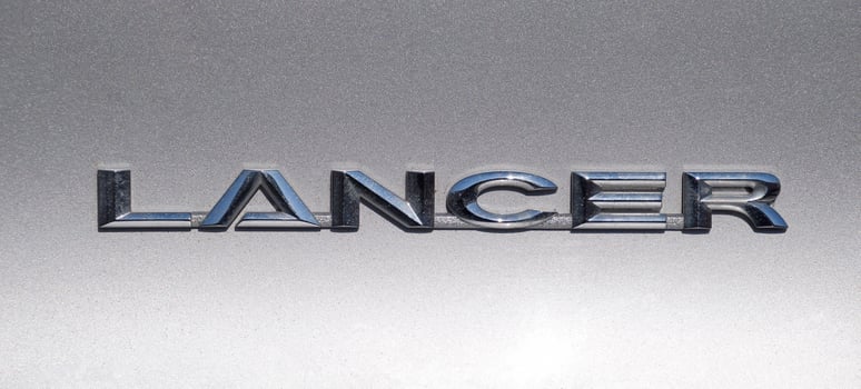 Lancer inscription on a silver background. Relief letters photo