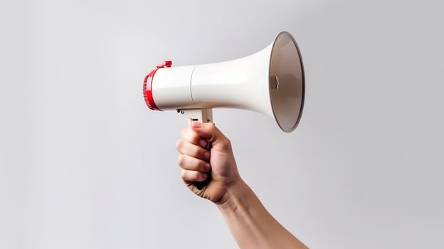 AI generated Hand holding megaphone over white background photo