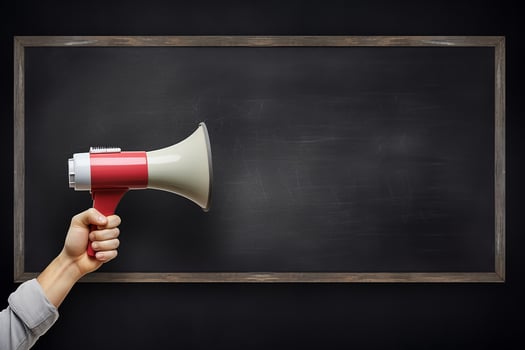 AI generated Hand holding megaphone over chalkboard background with copy space photo