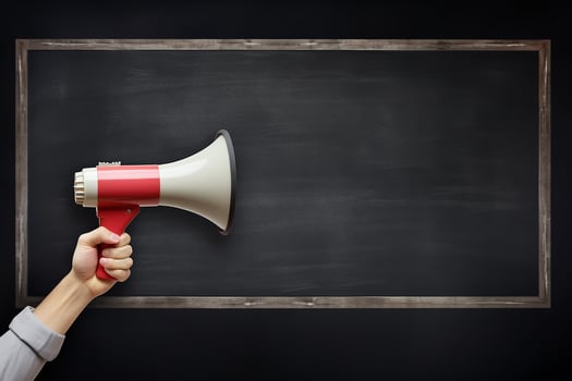 AI generated Hand holding megaphone over chalkboard background with copy space photo
