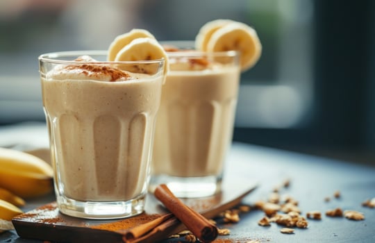 AI generated two glasses with banana smoothies photo