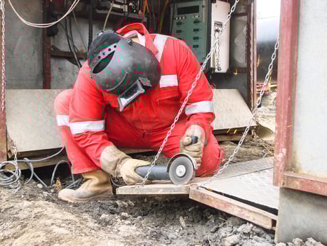 Safety at work. Welding and grinding of iron constructions. Industrial weekdays welders and fitters photo