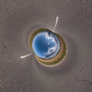 blue hole sphere little planet inside gravel sand round frame background photo