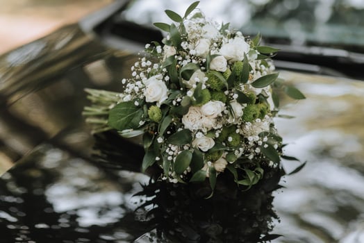 wedding bouquet in green style from different flowers on a black background photo