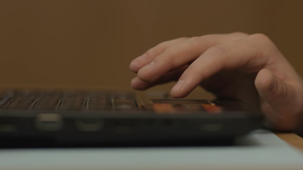 Close up of woman hand touching a tochpad on laptop. Close up of young businesswoman typing on computer laptop at the office or cafe photo