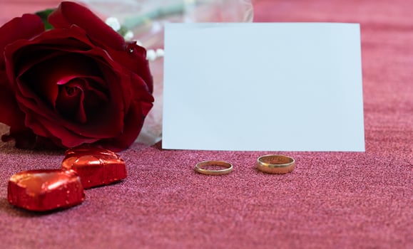 valentines day card rose golden rings and chocolates photo