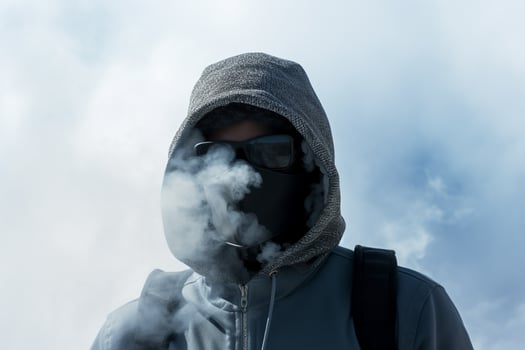 AI generated man wearing a gas mask standing around smoke with generative ai photo