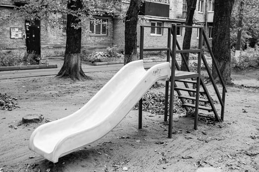 Photography on theme empty playground with metal slide for kids photo