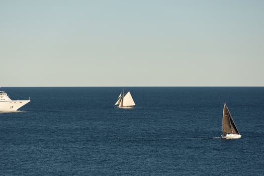 Monaco, vintage sail yacht and huge cruise liner are in sea at sunset, huge motor ship, wealth life of billionaires photo