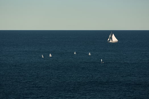 Monaco, lonely vintage sail yacht in sea at sunset, huge sail boat, wealth life of billionaires photo