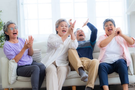 Happiness of the group females and male elderly sitting on the sofa. Senior people are talking and enjoy together at the living room. Joyful carefree retired senior friends enjoying relaxation. photo