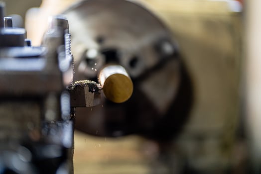 close up of machine operation for Metal Lathes. The steel column rolling in machine. metalworking industry. finishing metal working internal steel surface on lathe grinder machine with flying sparks photo