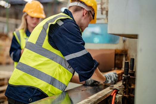 Engineers assess timber materials in a warehouse for suitability in production processes. photo