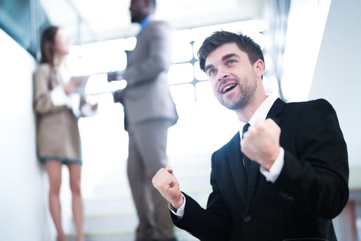 business people and office concept. happy smiling businessman in dark suit. Portrait of smiling mid adult businessman standing at corporate office. Businessman smiling with arms crossed in office. photo