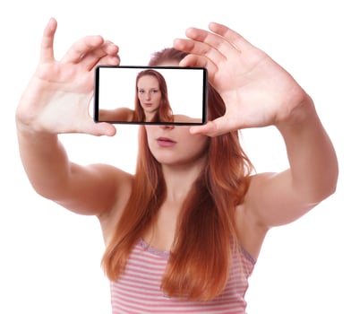 young woman taking selfie with mobile phone photo