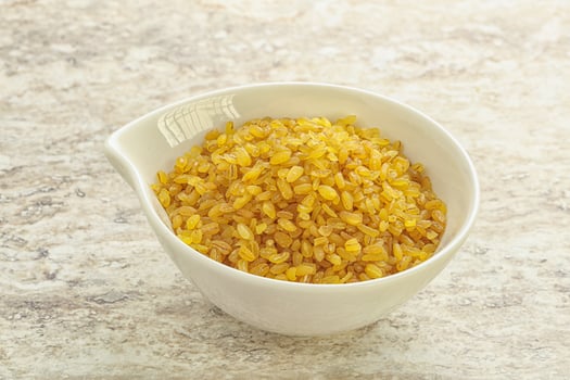 Raw bulgur in the bowl photo