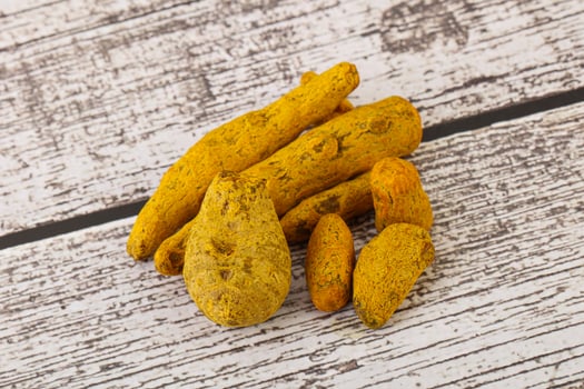 Indian spices - Turmeric root Curcuma photo