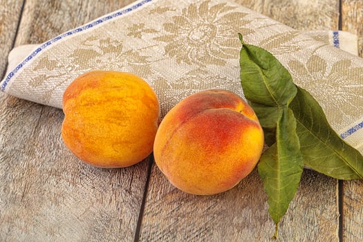Two ripe sweet peaches fruit photo