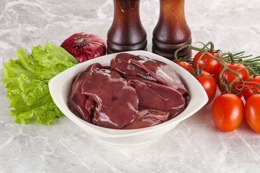Raw turkey liver in a bowl ready for cooking photo