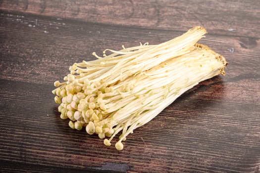 Tasty raw enoki mushroom heap photo