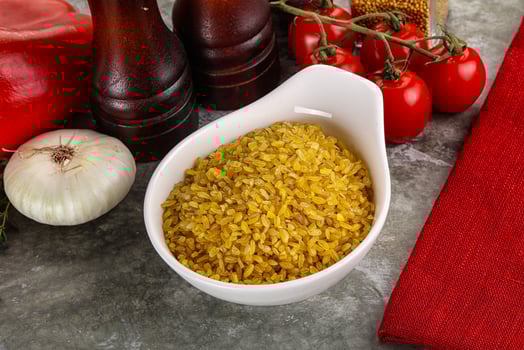 Dry wheat bulgur cereal heap photo