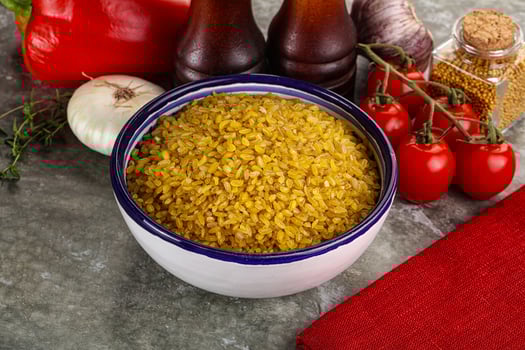 Dry wheat bulgur cereal heap photo