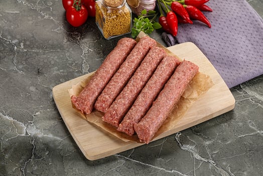 Raw beef kebab sausage for grill photo