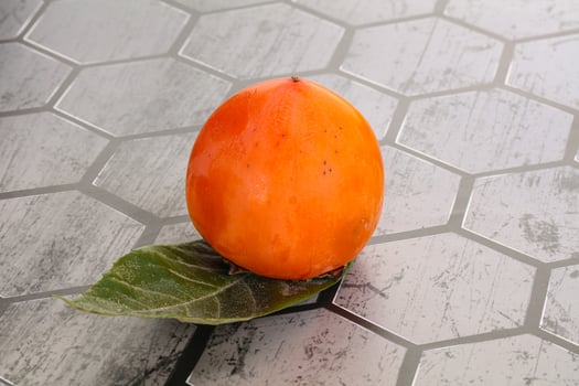 Fresh ripe sweet juicy persimmon photo