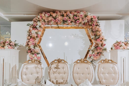 Presidium of the bride and groom at the wedding. Everything is almost ready for the wedding celebration. A wedding banquet, many flowers, a rich and refined wedding photo
