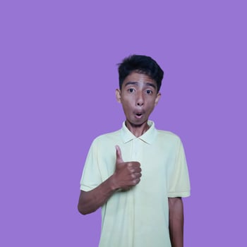 Asian man smiling face with okay gesture, isolated on purple background photo