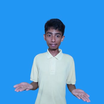 surprised asian man with both hands forming a photocopy in the middle area photo