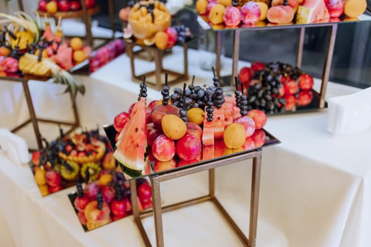 a buffet with fruit, champagne and cold drinks organized in a restaurant on a wedding day or birthday photo