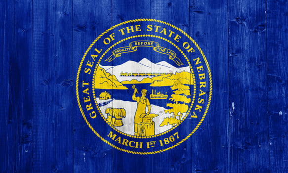 Flag of Nebraska state USA on a textured background. Concept collage. photo