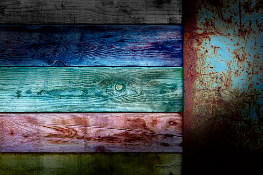 Wooden colors board with end old metal rusty placard photo
