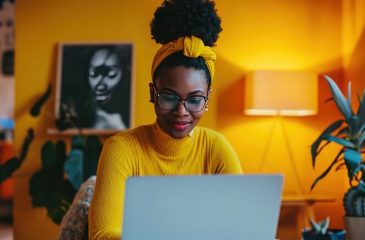 AI generated a woman working in her office with a laptop photo