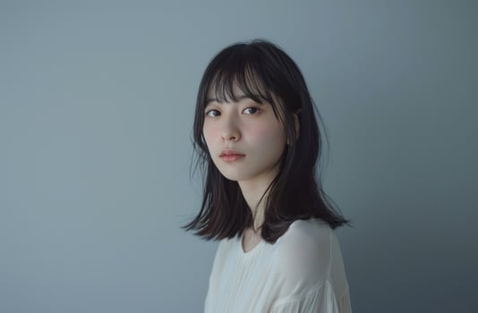 AI generated a young woman standing in front of a gray background photo