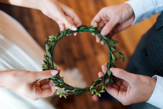 bride's wreath of greenery and fresh flowers. Wedding in a rustic style, details of the bride. Preparation for the wedding photo