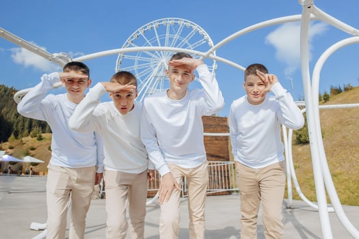 friendship, movement, action, freedom and people concepts - group of happy teenage students or school friends posing and having fun outdoors on beautiful place background. photo
