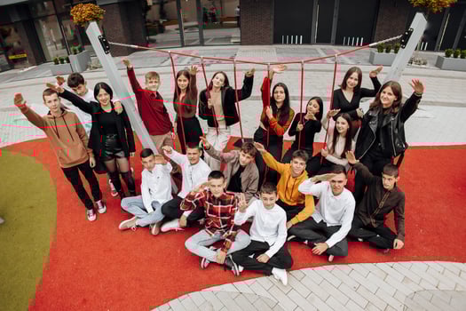 Group of many happy teenagers dressed in casual clothes having fun and having fun near college. Concept of friendship, moments of happiness. School friendship photo