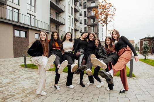 Group of many happy teenagers dressed in casual clothes having fun and having fun near college. Concept of friendship, moments of happiness. School friendship photo