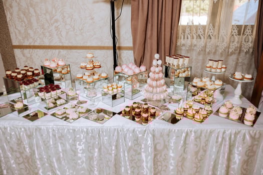 Almond cookies and various sweet cakes for a wedding banquet. A delicious reception, a luxurious ceremony. Table with sweets and desserts. Delicious colorful French desserts on a plate or table. photo