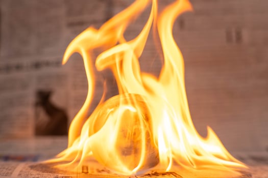 Glass globe on fire. Planet Earth Burning. Global Warming and Climate Change Concept. photo