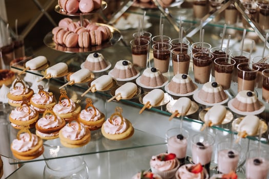 Almond cookies and various sweet cakes for a wedding banquet. A delicious reception, a luxurious ceremony. Table with sweets and desserts. Delicious colorful French desserts on a plate or table. photo