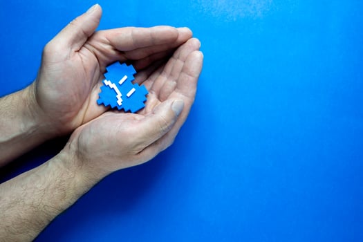 Blue Monday Concept. Hands of a man holding a blue heart. photo
