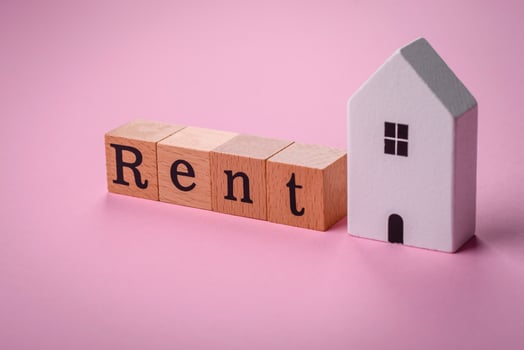 Small wooden house and the inscription for rent. Concept for sale, rental of real estate for a family photo